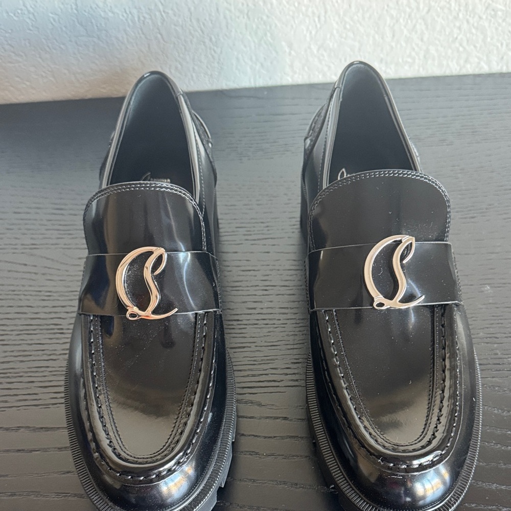 Stunning Christian Louboutin CL Moc Lug leather loafers in black. New